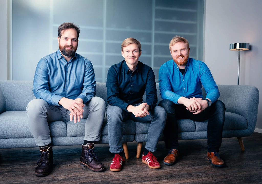 The three kiutra co-founders sitting together on a sofa in the office.