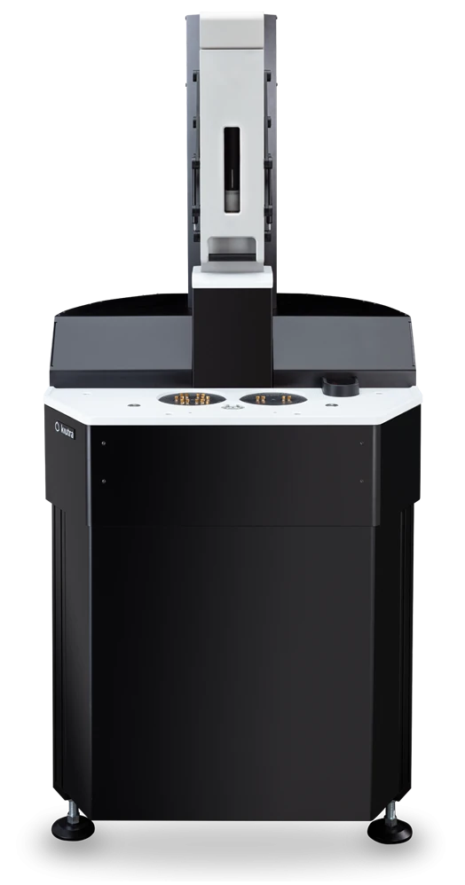 L-Type Rapid cryostat, front view: black cabinet with a white top plate carrying two puck openings, the sample-loader column above it.
