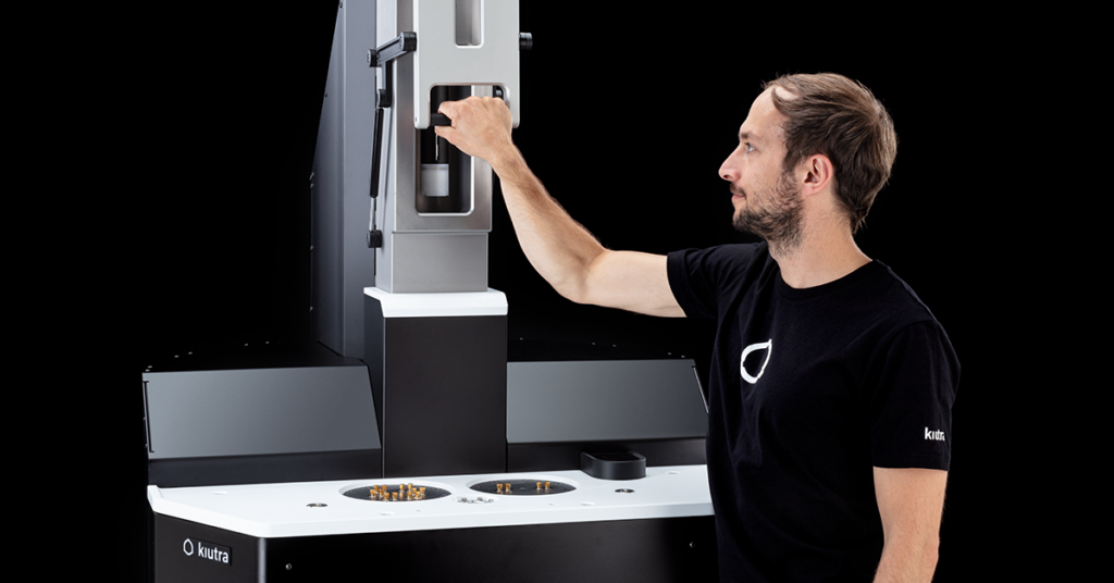 Person loading sample into a L-Type Rapid cryostat.