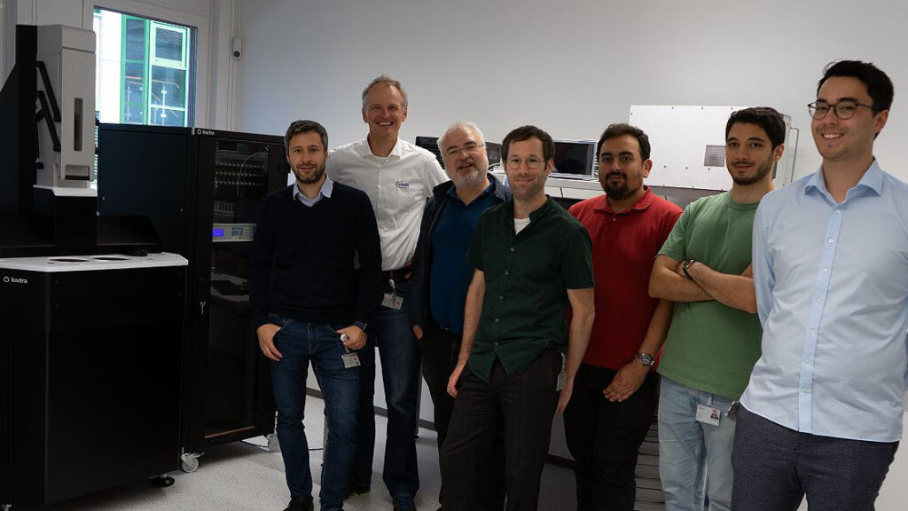 Infineon team with L-Type Rapid in the background.